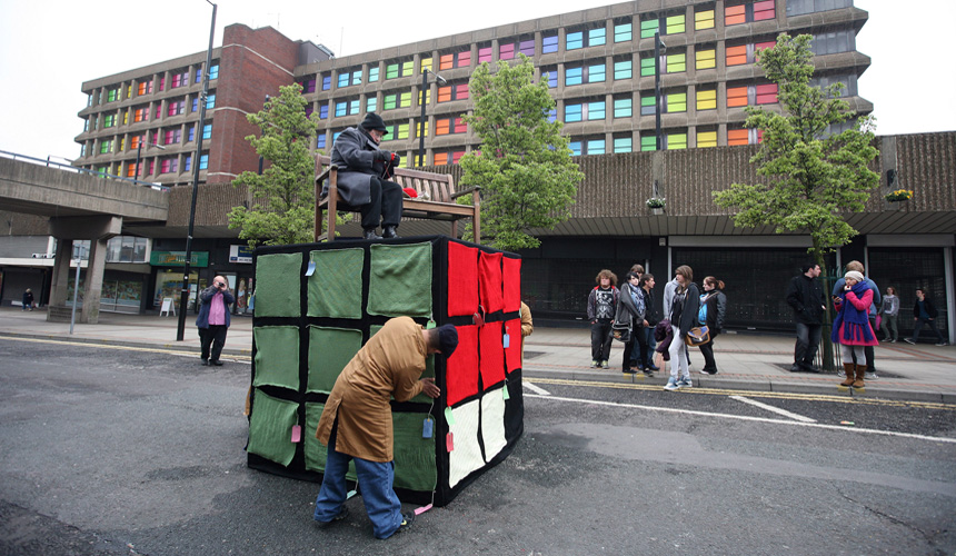 Picture of woman on bench on Immovable block knitting