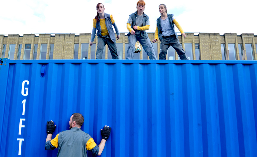 Picture of the girls dancing on top of the container