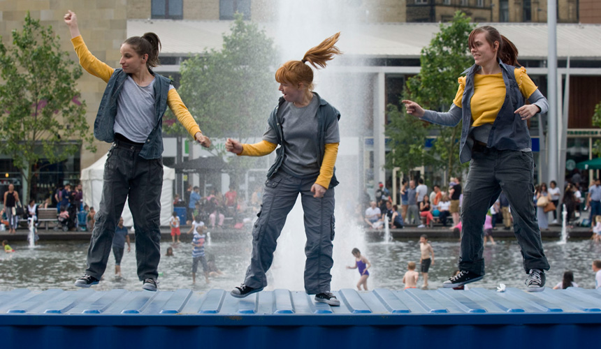 Picture of girls dancing on top of the container