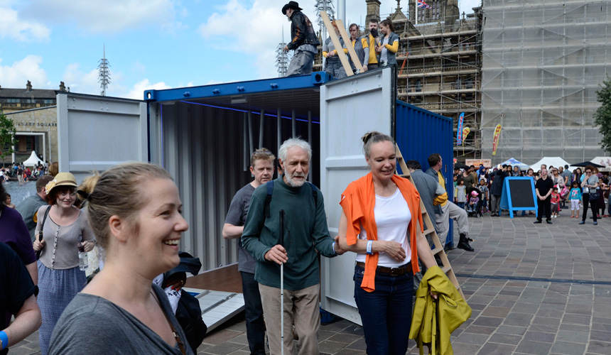 Picture of the audience coming out of the container