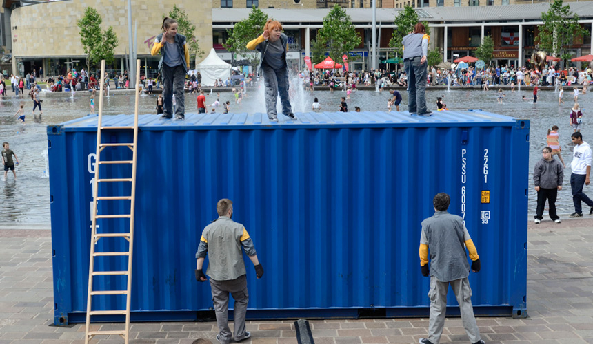 Picture of the girls dancing on top of the container