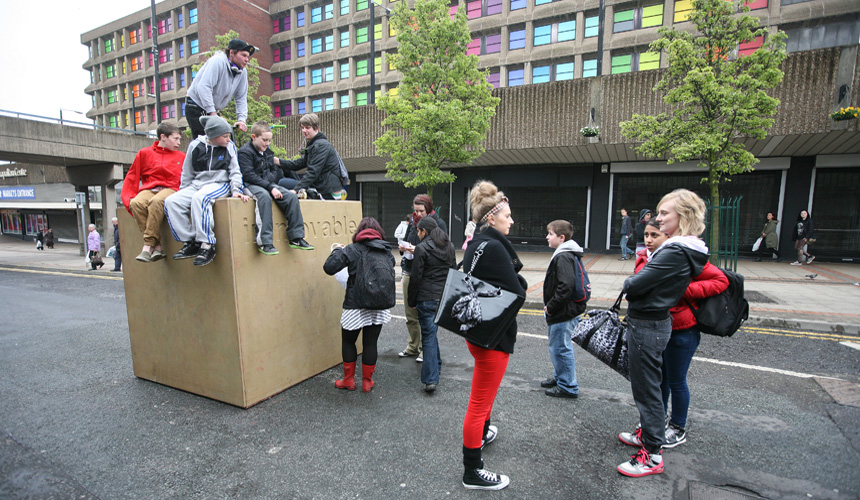Picture of a group of young people around Immovable block
