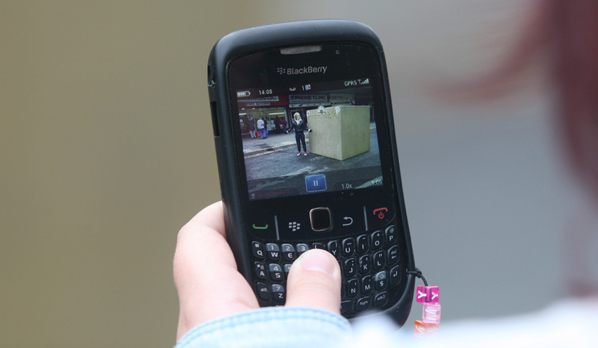 Picture of a picture being taken on a mobile of the Immovable block