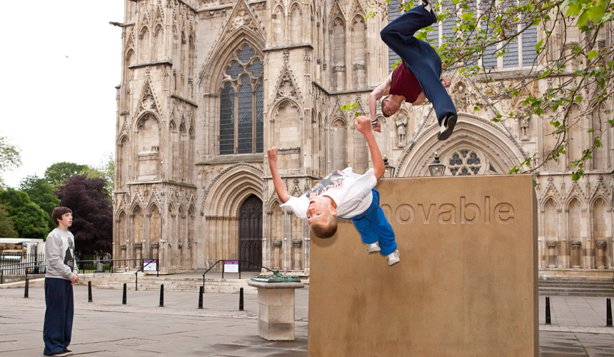 Picture of two boys jumping off Immovable block