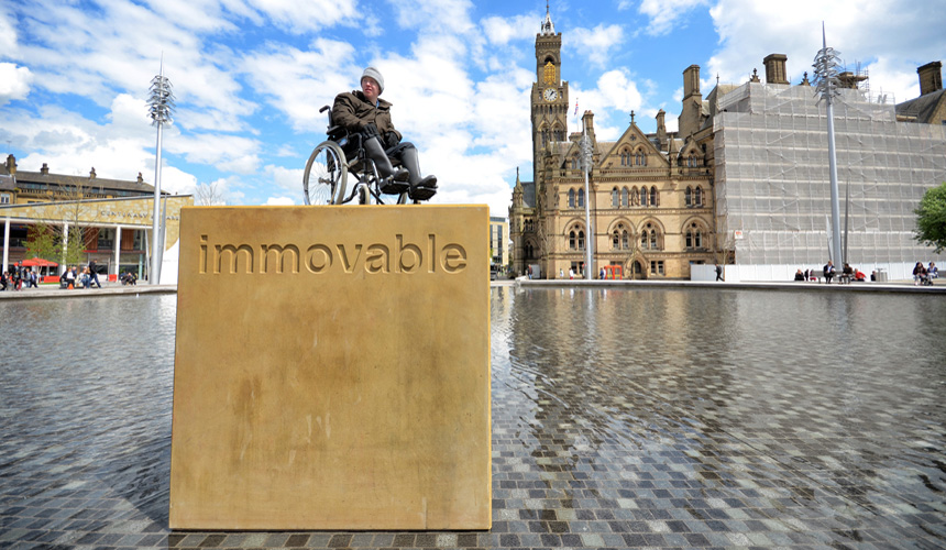 Picture of man in wheelchair on top of Immovable block