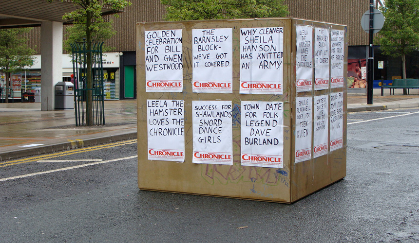 Picture of Immovable block with posters stuck on to it