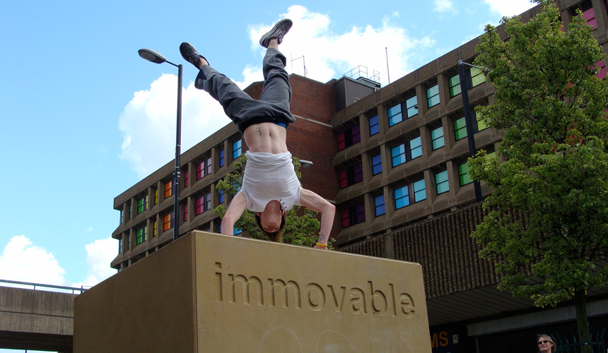 Picture of man doing handstand on the Immovable block