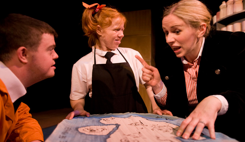 Picture of 3 people looking at a treasure map