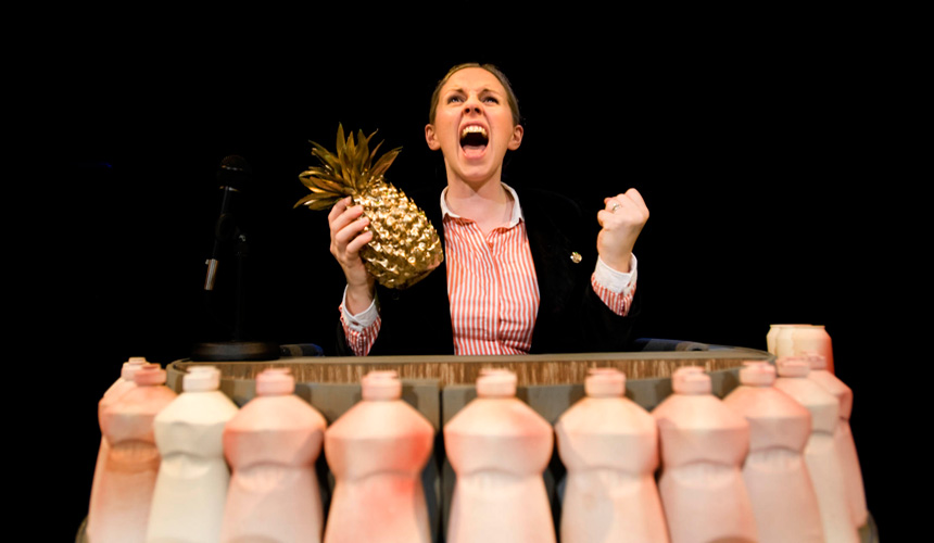 Picture of a woman holding a pineapple on the Treasure Island set