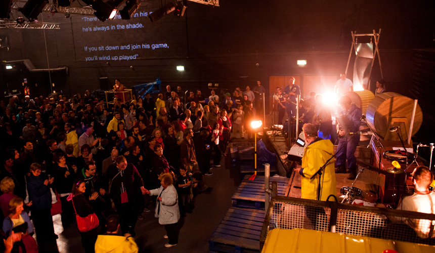 Long shot of audience watching a band on stage