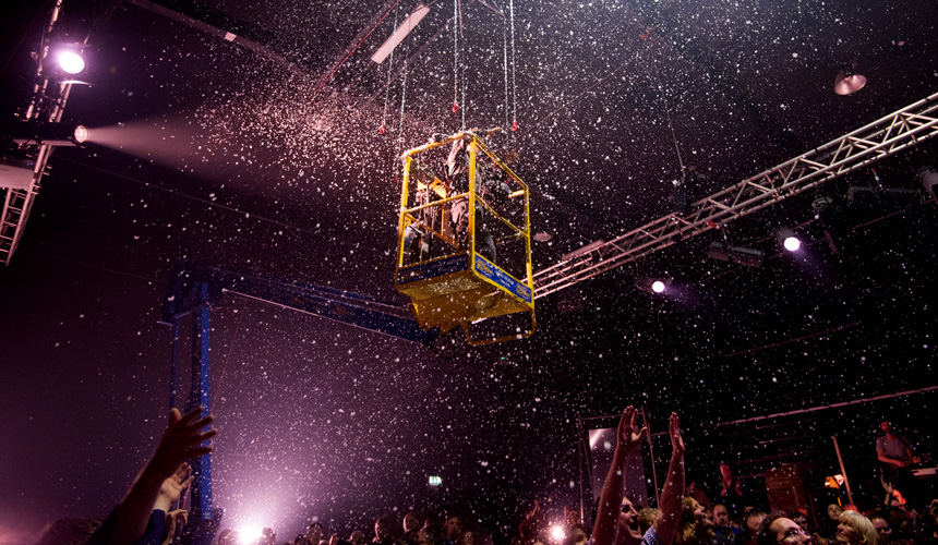 Jez Colborne in a cherry picker surrounded by snow